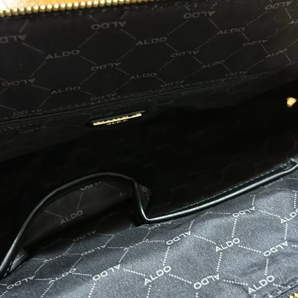 Aldo Faux leather handbag. Shoulder strap missing. Good condition. Black.